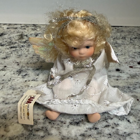 Porcelain Angel Doll with Golden Hair and Iridescent Wings - Picture 3 of 6